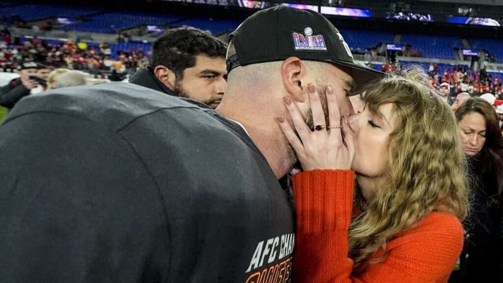 Taylor Swift gives a kiss to Travis Kelce headed to Super Bowl after winning the AFC title game | Image Credit: wptv.com