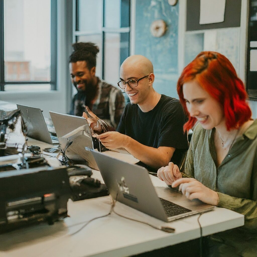 Diverse group of writers working together in a collaborative workspace, representing the human element of content creation | Image Credit: Gemini.Google