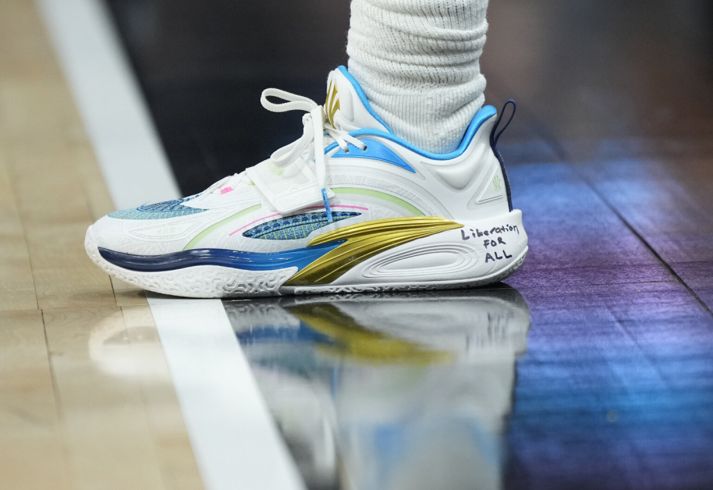 Kyrie Irving often decorates his shoes with handwritten messages, including “Liberation for all." | Image Credit: forward.com