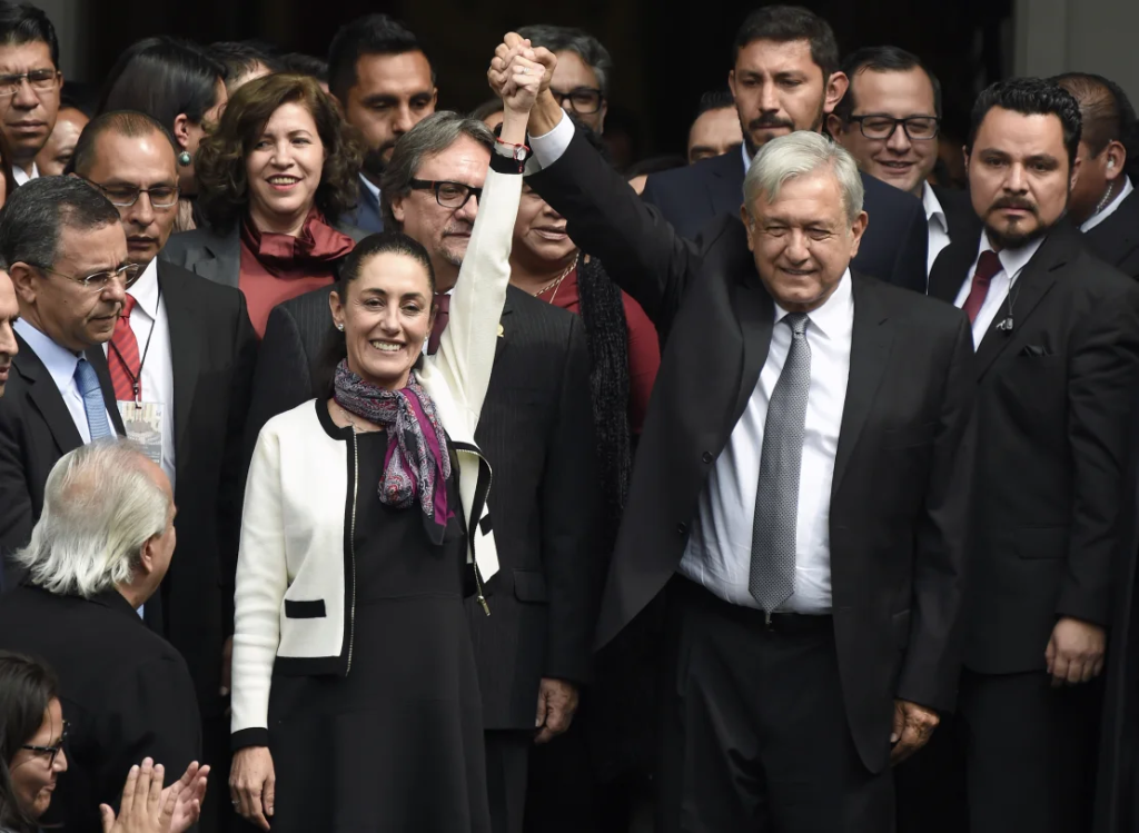 Mexican President Andres Manuel Lopez Obrador (right) raises the hand of Claudia Sheinbaum | Image Credit: edition.cnn.com
